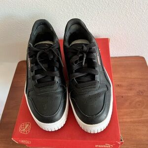 Puma Black and Gold Sneakers